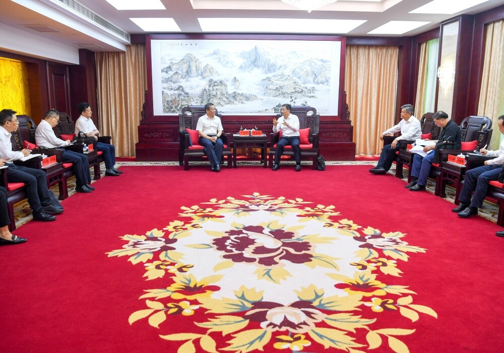 许忠建会见丁建华一行